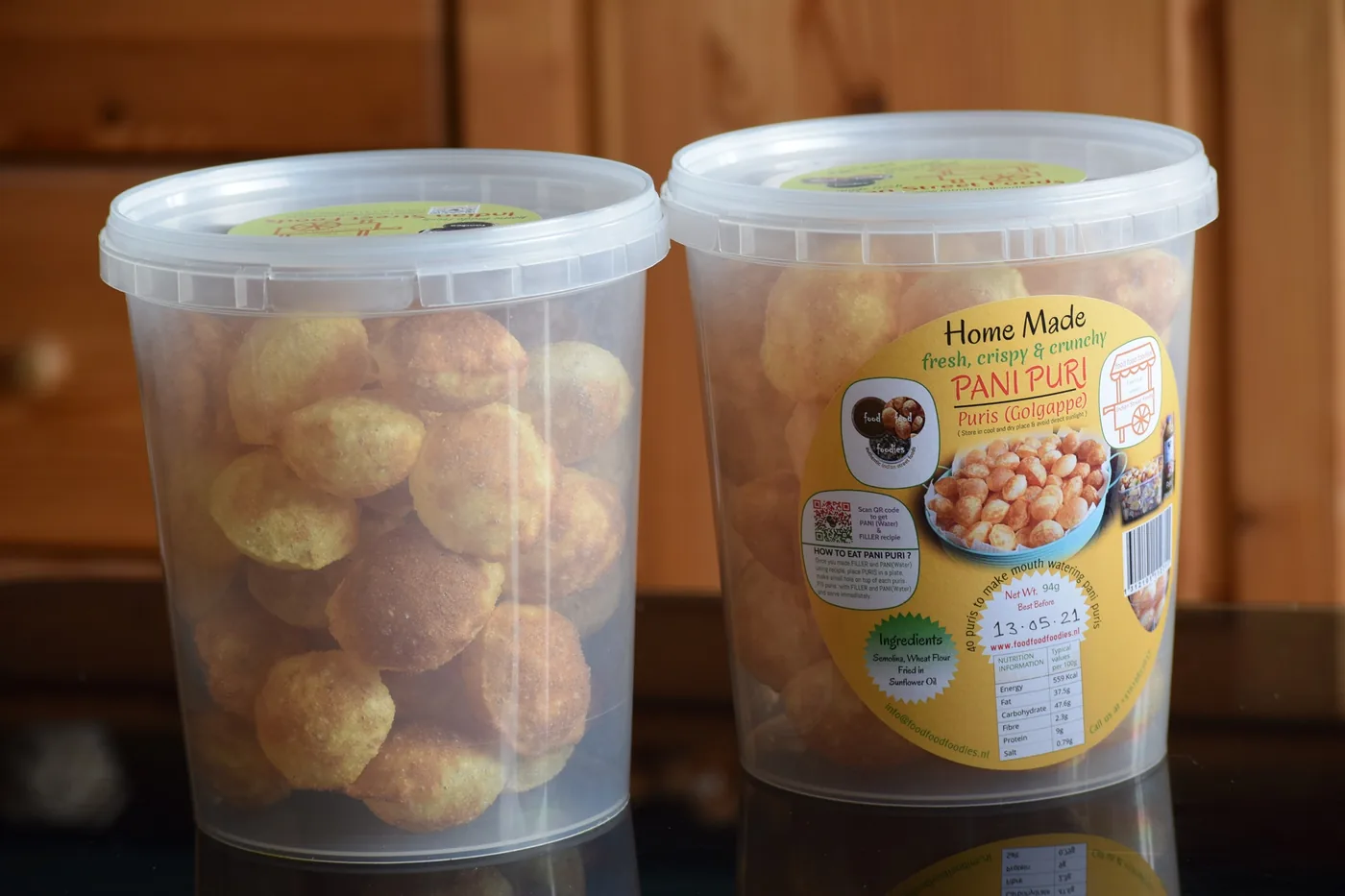 Two packaged pani puri tubs from foodfoodfoodies