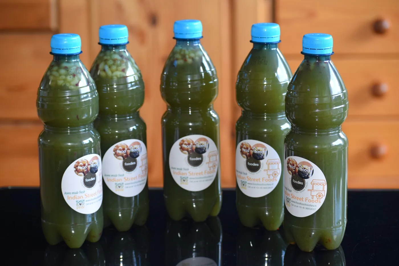 Small bottles of pani puri water from foodfoodfoodies